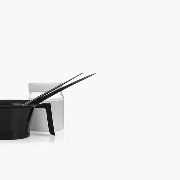 Black measuring cup and spoon on a white background. Black measuring cup and spoon on a white background.